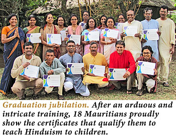 graduates holding their certificates