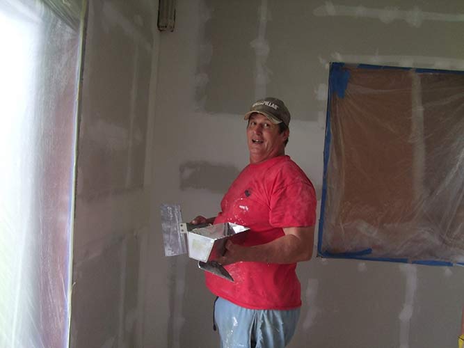 John Anderson has amazing skills. Here he finishes of covering wall board joints.