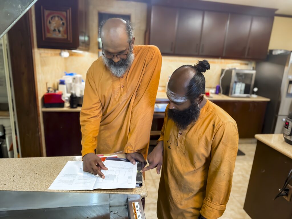 Yoginathaswami and Mayilnathaswami discuss options for adding some more space around it