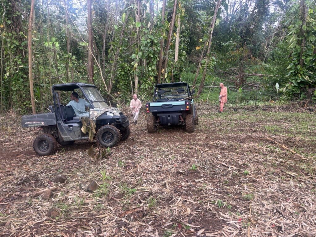 Monks maintain the grounds at Kauai Aadheenam with their UTVs.